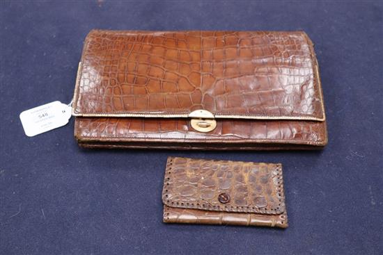 A 9ct gold mounted crocodile skin clutch bag, retailer Davis of Picadilly